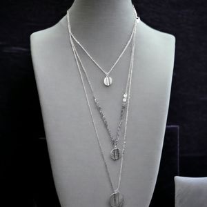 New ANA triple strand silver colored necklace with coin pendant